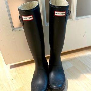 Tall black Hunter rain boots
